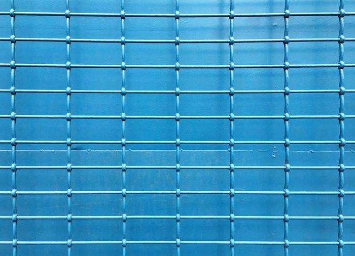 Full frame shot of blue metal grate