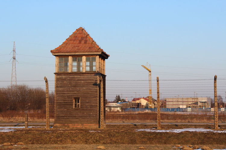View of building on field against clear sky