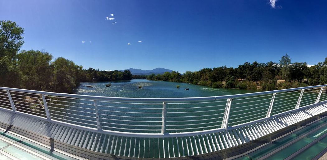 Scenic view of swimming pool against clear blue sky
