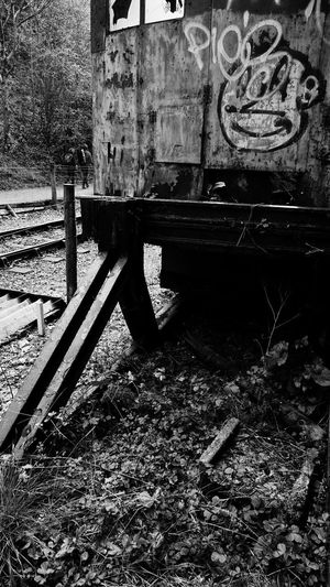 Abandoned bench on railroad track