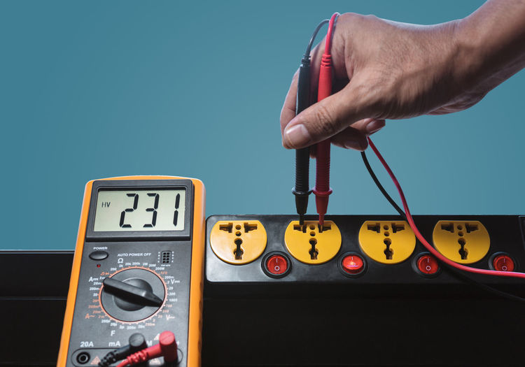 Measure the ac voltage of 230 volts from the power outlet with a digital meter.