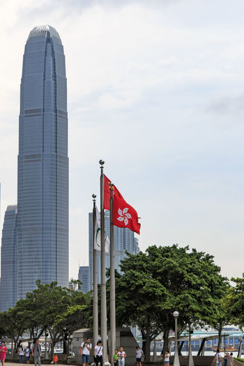 Hong kong flag against two international finance center in city