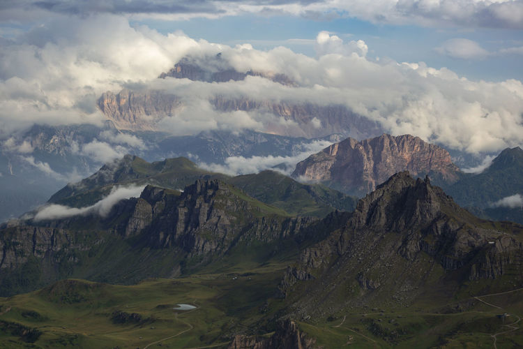 Scenic view of mountains against cloudy sky