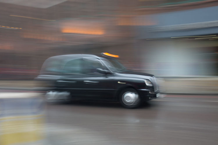 Blurred motion of car moving on road