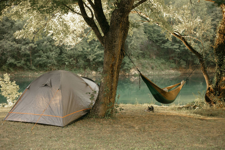 Tent and hammock by the river