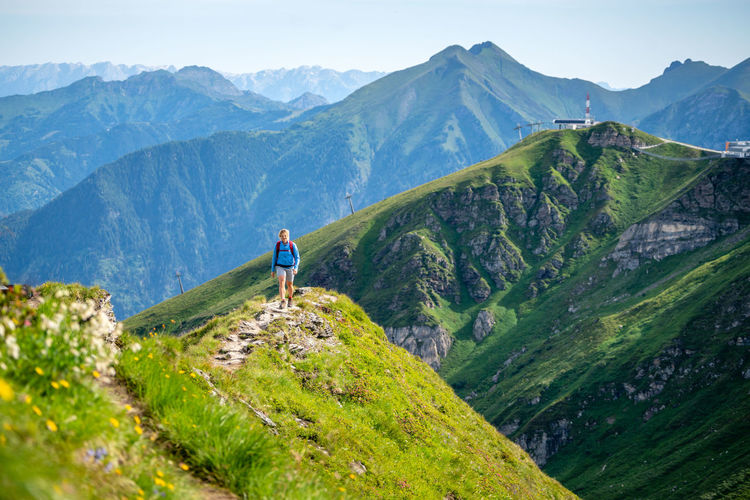 Woman walking on mountain