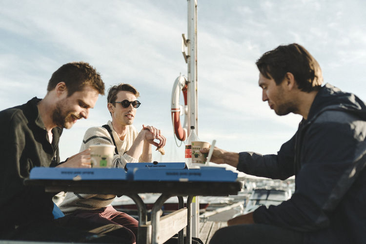Men at marina having coffee
