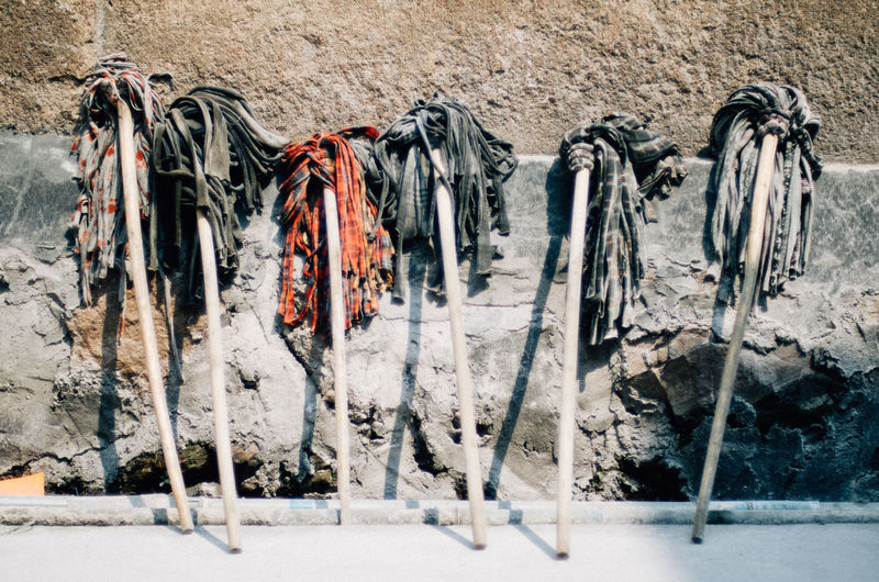 Various mops against wall
