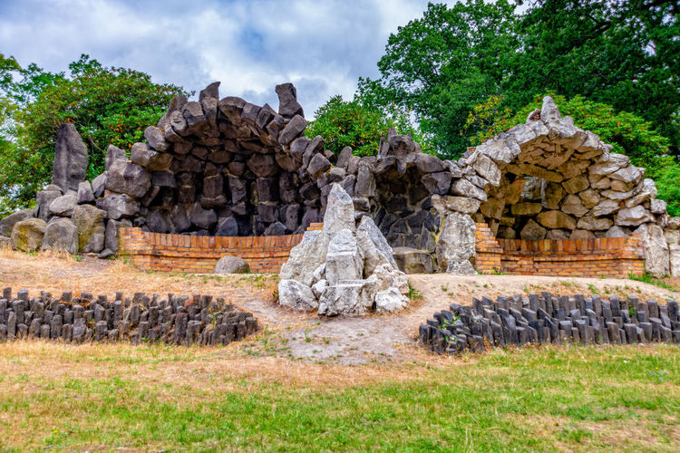Old ruins of temple against cloudy sky