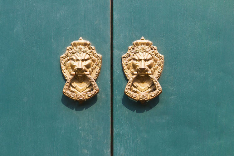 Close-up of knockers on door