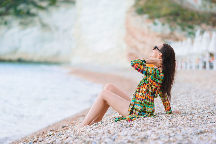 Woman sitting on beach