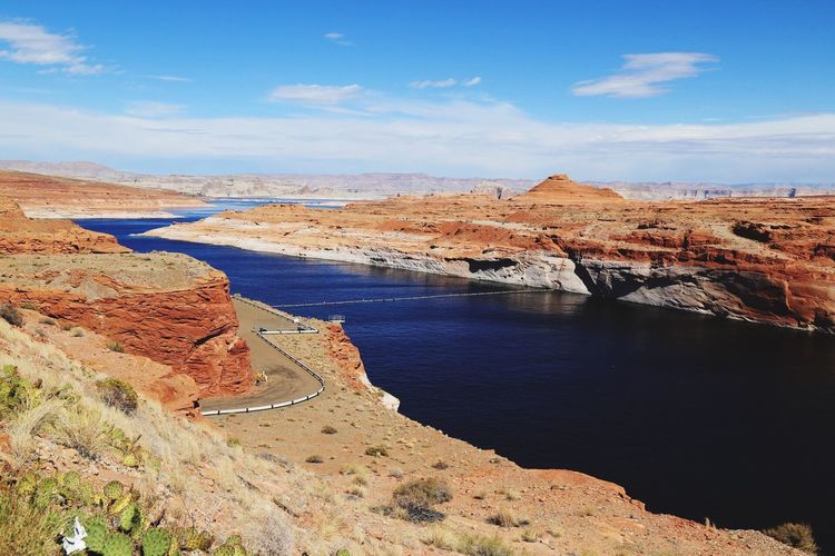 Scenic view of lake powell against cloudy sky