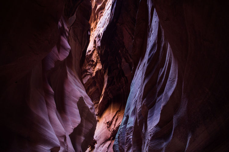 Slot canyon walls colorfully illuminated by the sun