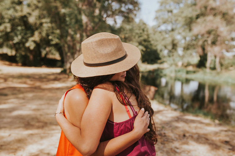 Close-up of young woman hugging