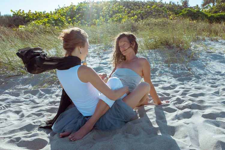 Close-up of women embracing at beach