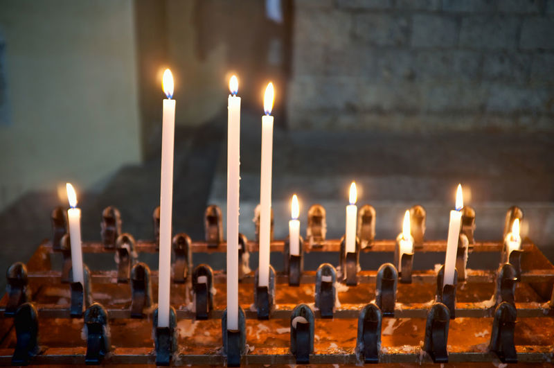 Lighted candles in an old church