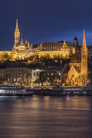 Illuminated buildings at waterfront