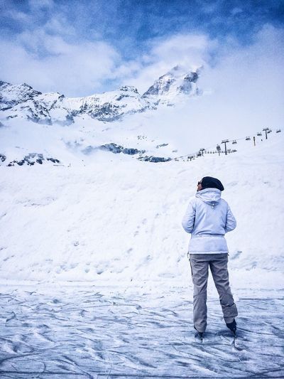 People standing on snow covered mountain