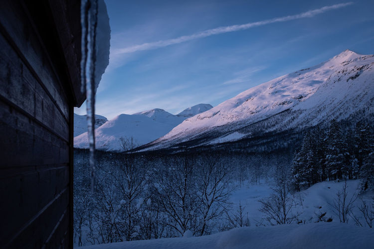Scenic winter landscape in norway with snowy mountains.