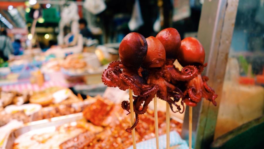 Close-up of roasted octopus for sale at market stall