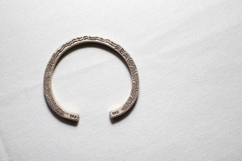 Close-up of ring on white background