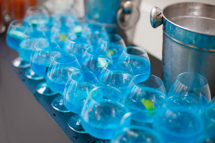Close-up of blue drinks served on table