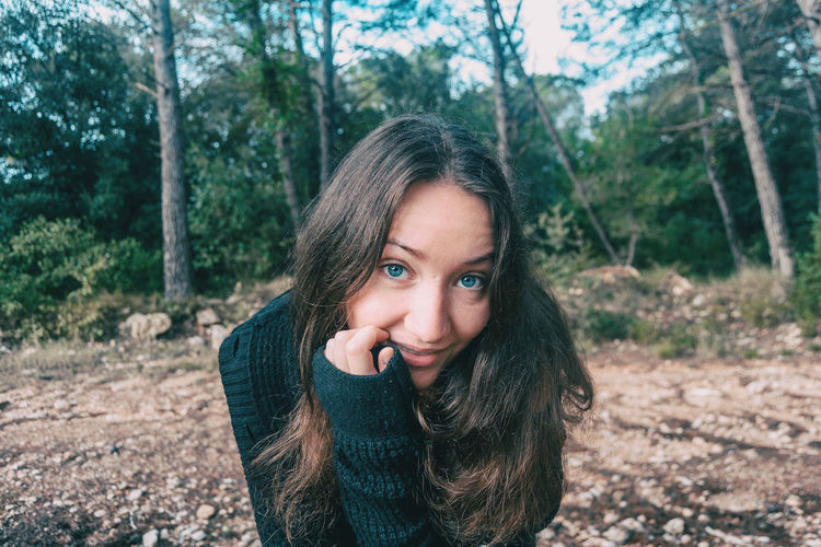Portrait of a beautiful young woman in forest