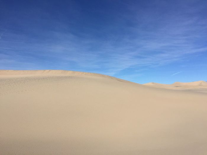 Scenic view of mesquite flat dunes against sky