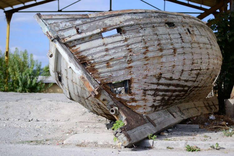 Abandoned boat on field