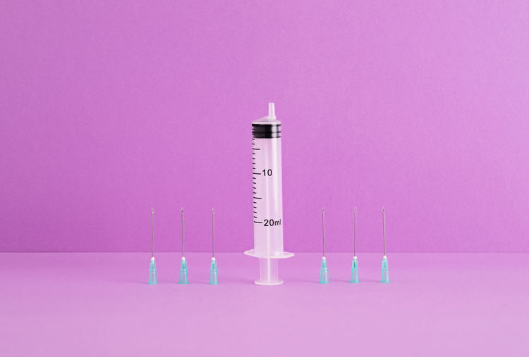 View of communications tower against pink background