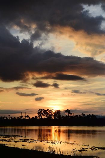 Scenic view of lake against sky during sunset