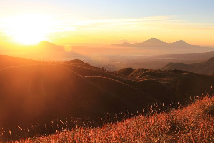 Scenic view of landscape against sky during sunset