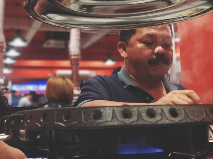 Low angle view of man cooking food