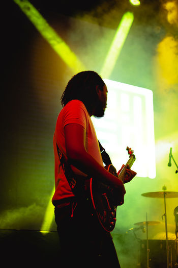 Close up of a guitar player at a concert