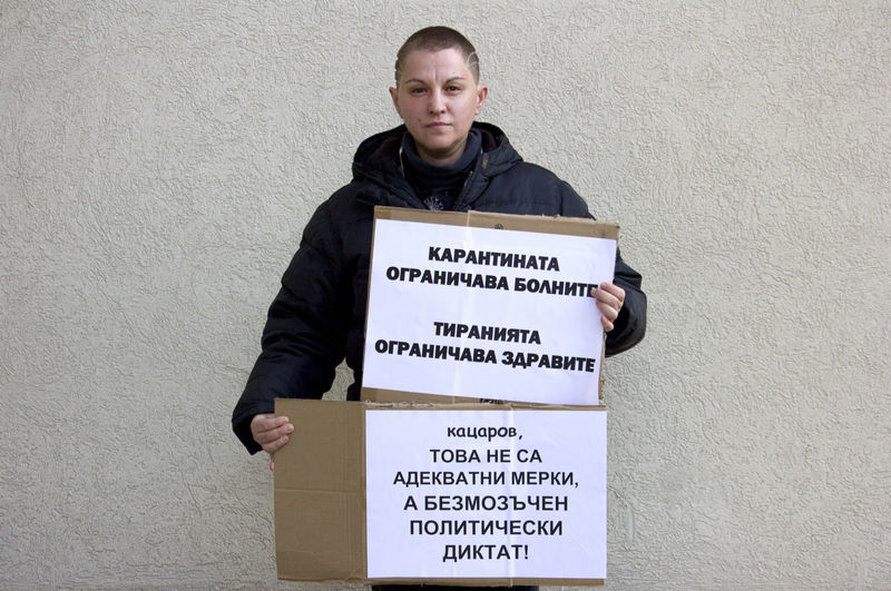 Low section of man standing against wall