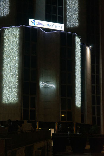 Illuminated text on building at night