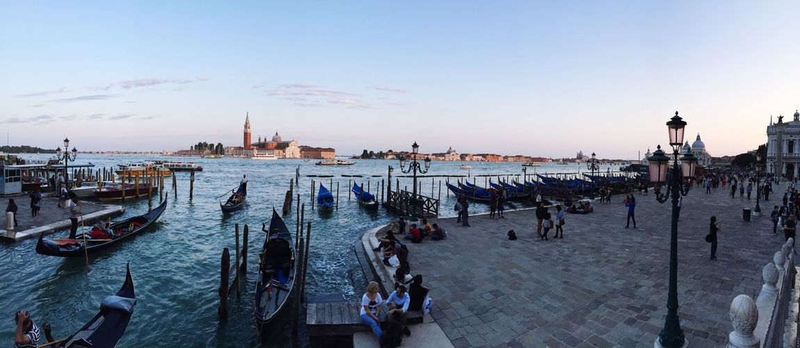 High angle view of tourists by gondolas in grand canal