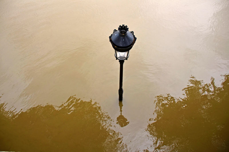 High angle view of lamp post in water