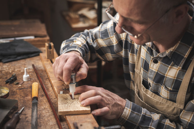 Man working on wood at workshop