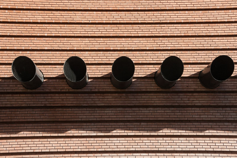 Close-up of ventilation pipes on wall