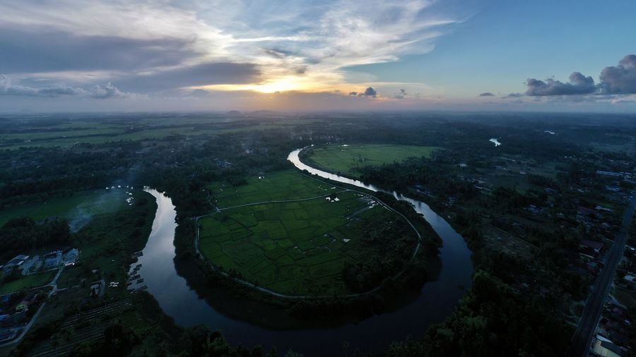 Aerial view of river against sky during sunset