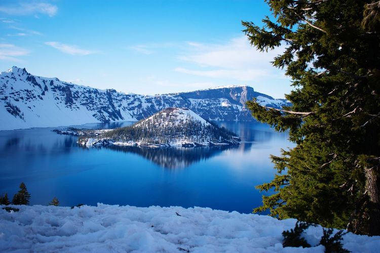Scenic view of snowcapped mountains against sky during winter