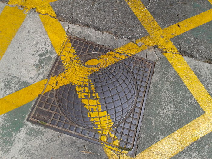 Close-up of yellow markings on road