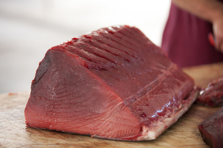 Close-up of tuna fish on cutting board