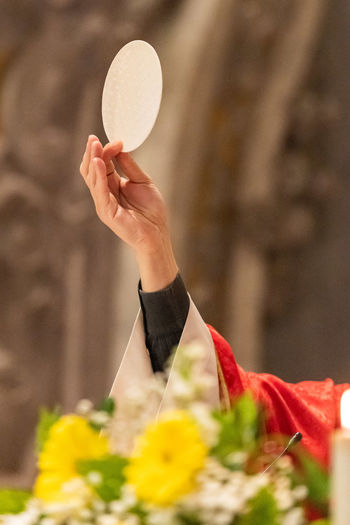 The elevation of the sacramental bread during the catholic liturgy