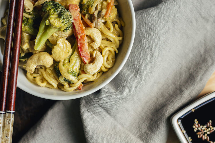 Yellow curry noodles with vegetables and cashews