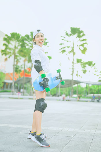 Portrait of smiling girl standing outdoors