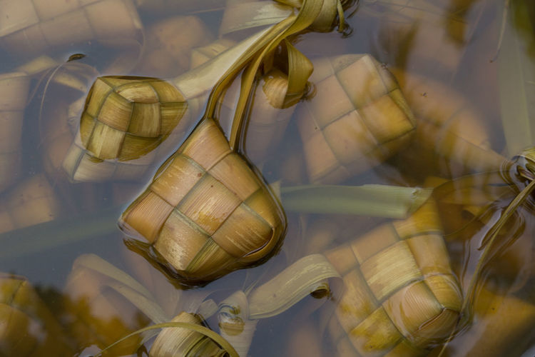Ketupat is a type of dumpling made from rice packed inside  woven palm leaf pouch.