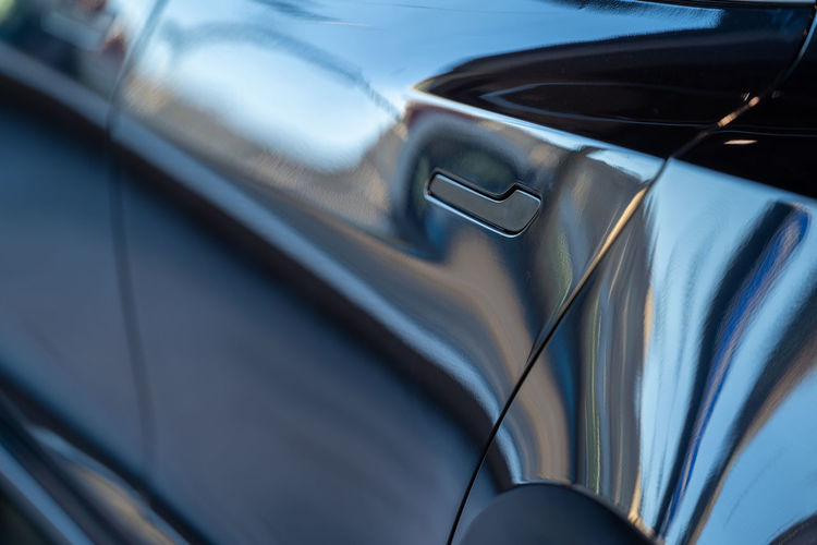 Close-up of keyless door handle of car