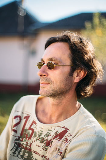 Close-up portrait of mature man with sunglasses